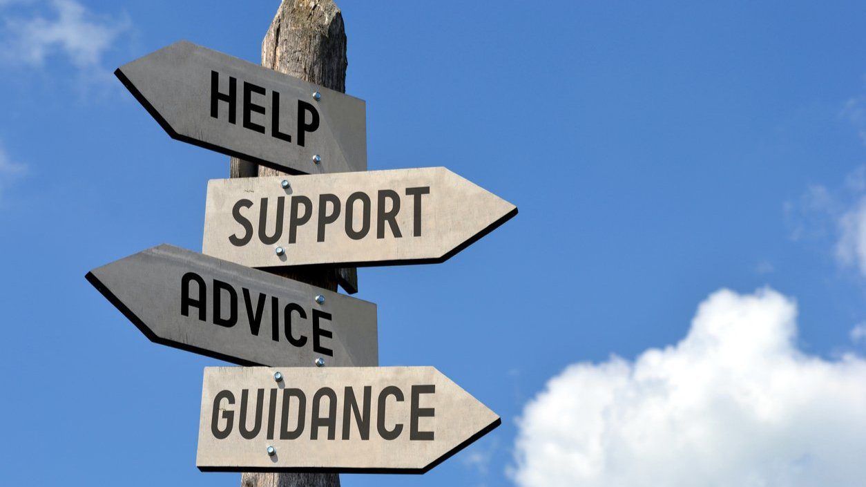 A road map sign for help, support advice and guidance